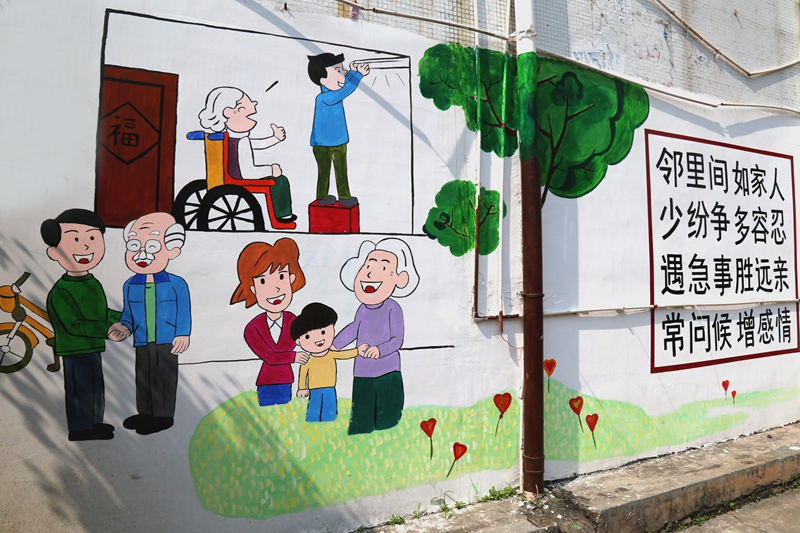 以"邻里和谐"为主题的墙绘分布在各小区入口.图片来源:博罗文明网