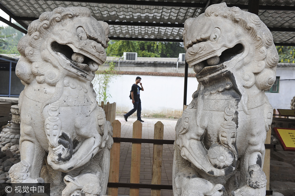 圆明园石狮子口中石球疑似丢失一颗,文物部门称正在进行调查